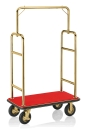 Gepäckwagen mit goldfarbenen Rohrrahmen und rotem Teppich